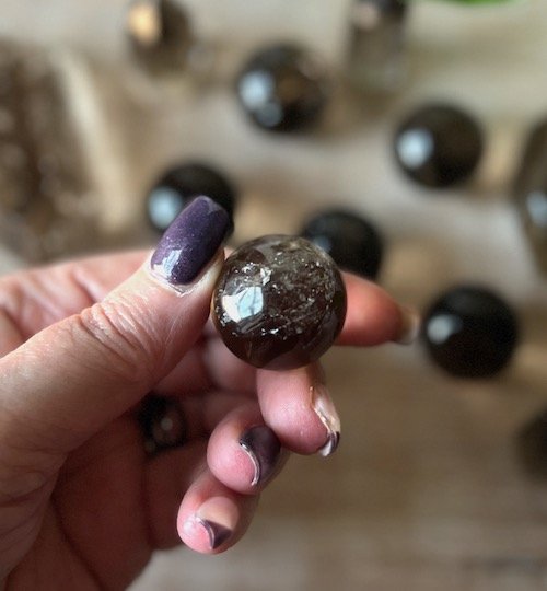 mini smoky quartz crystal sphere.jpeg