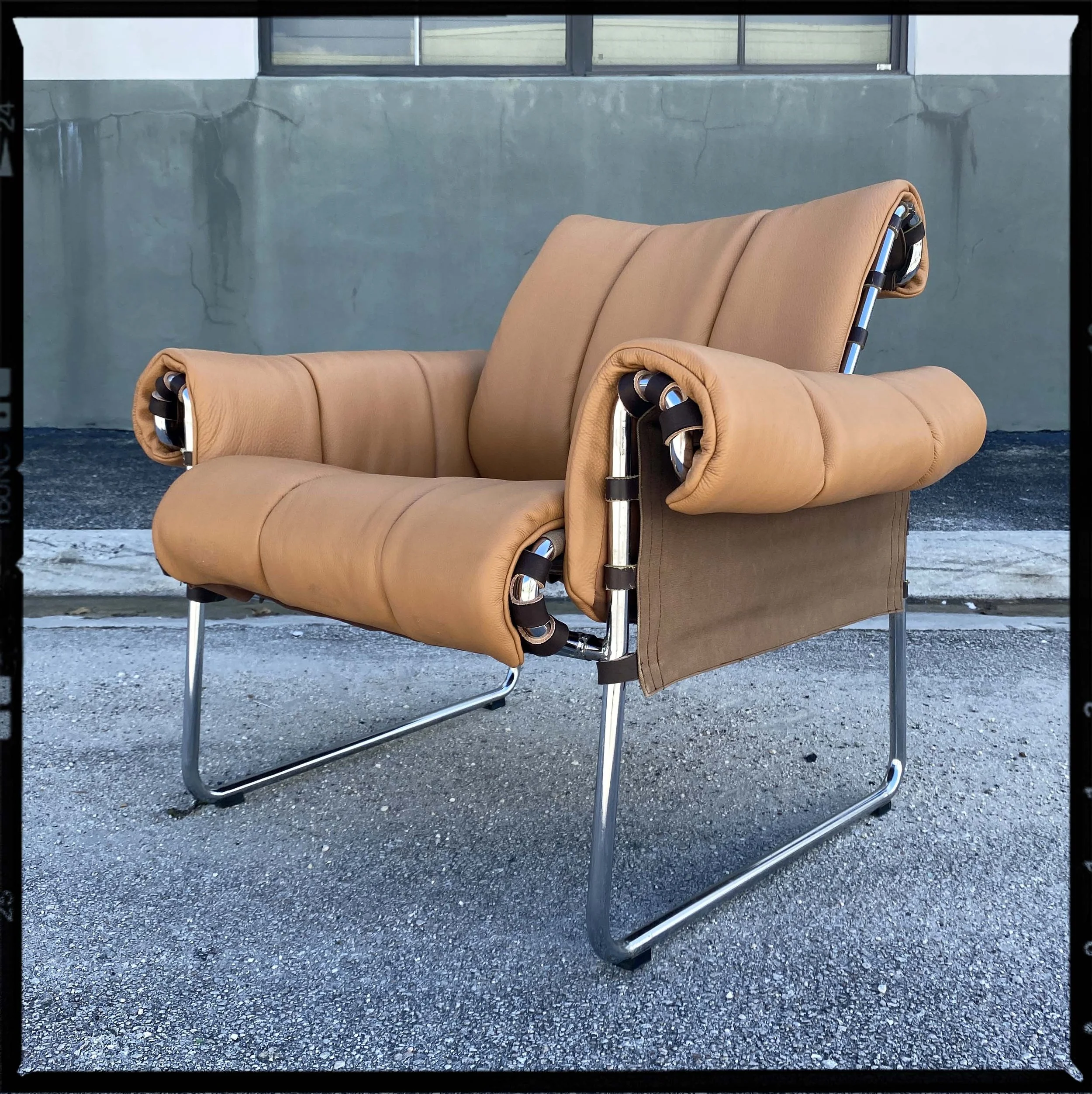 Mid Century tubular chrome and leather chair