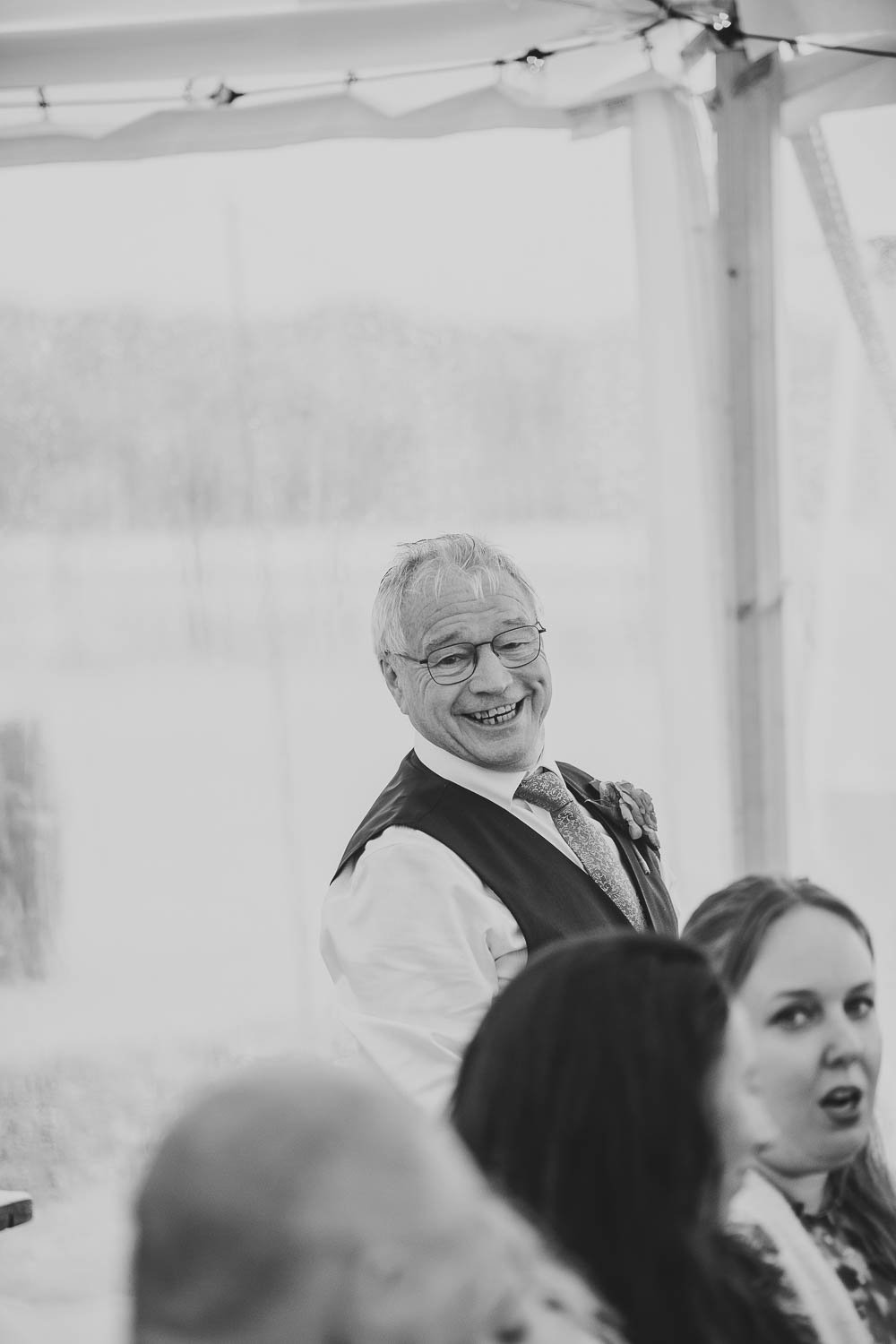 An excited father of the bride waiting for his daughter at her wedding.