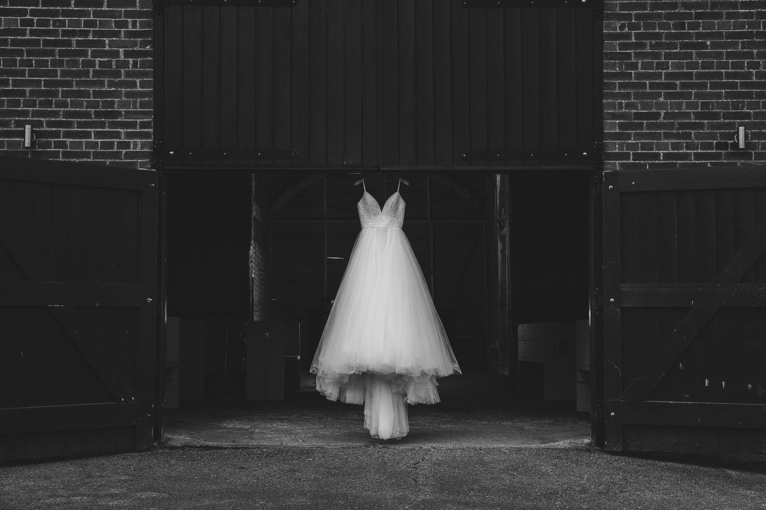 Dress floating in doorway of The Old Barn at Milling Barn