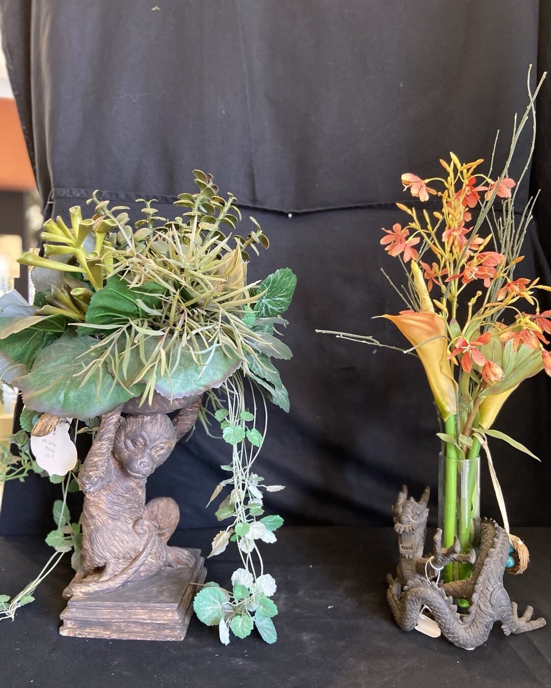 The monkey and dragon fell in love at the idea shops. Where they have been hanging out together, Beautiful faux plants . The planters  are 20 inches high price $95.00 . #monkey, #dragon. #faux plants, #asian design, #statement center piece