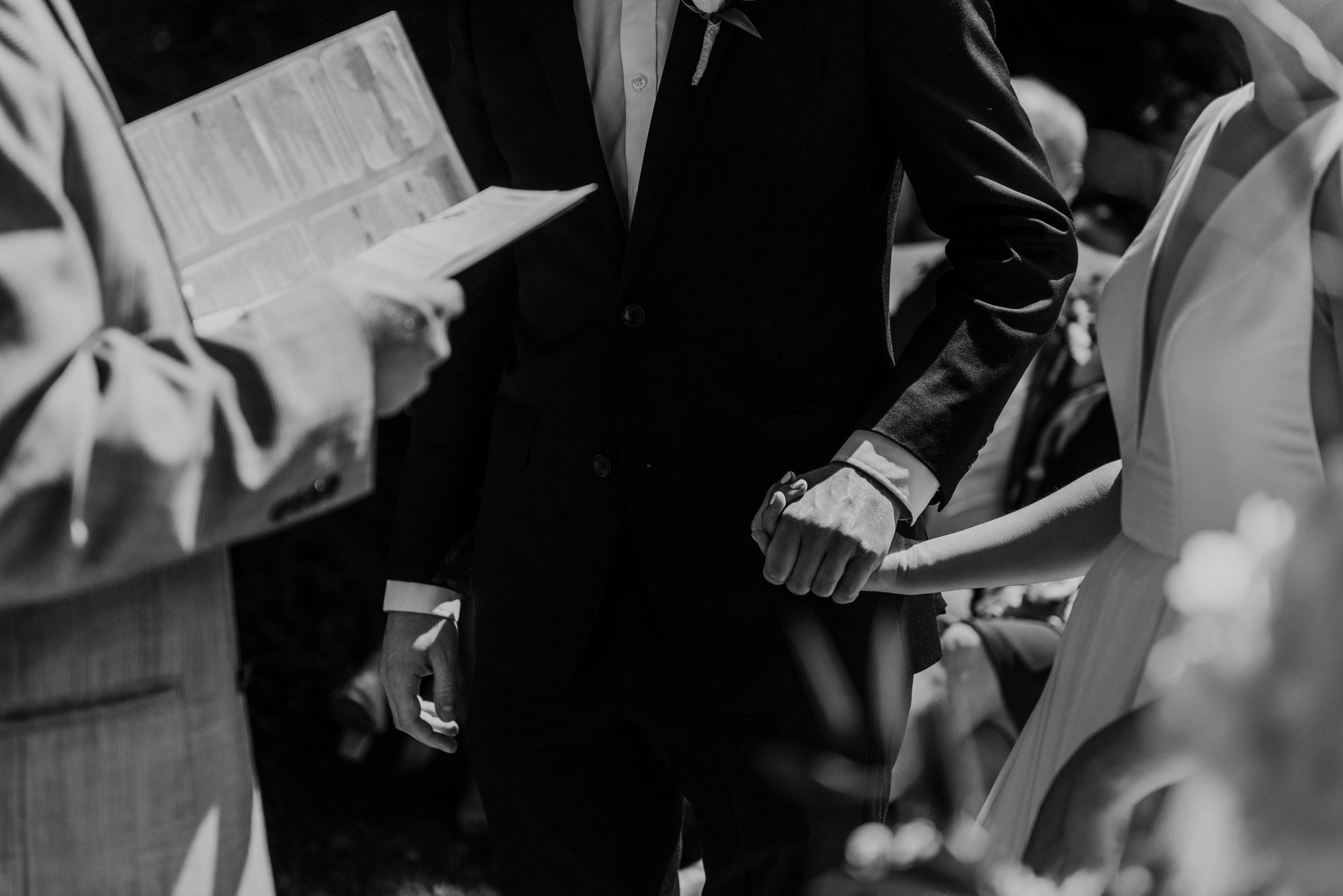 Bride and groom holding hands, wedding at the Hyeholde