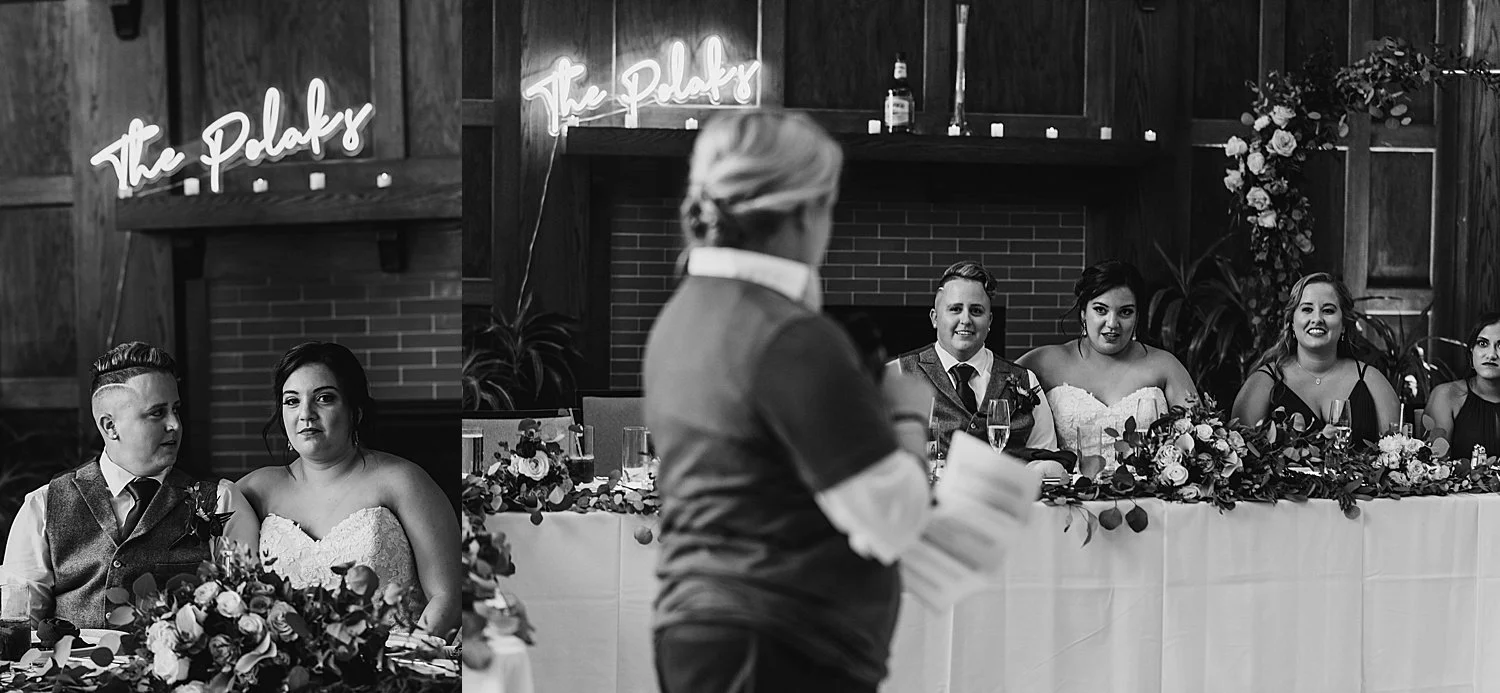 Wedding party listening to speeches, the speaker is in the foreground out of focus