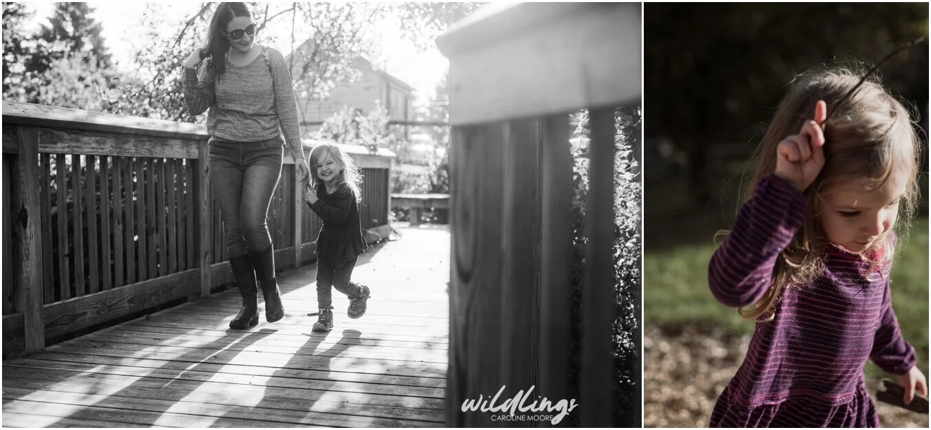 A toddler holds hands with her mom while they walk across a bridge at Beechwood Nature Reserve in Pittsburgh