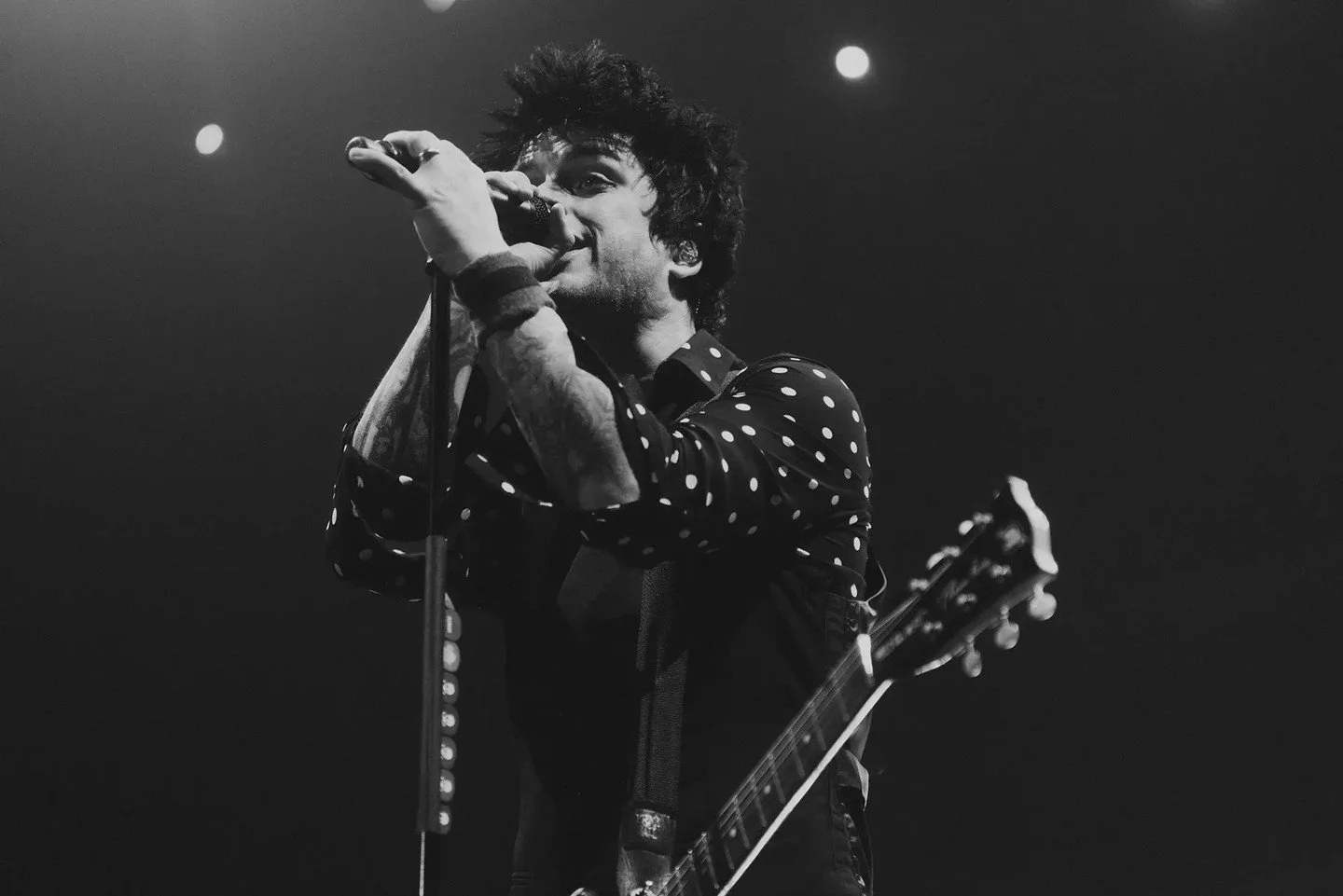 I once had a groom tell me that he thought it was rad that his wedding photographer (that's me) also shot Green Day and Propagandhi and other bands he'd grown up on. I learned photography by taking photos in VFW halls and basement venues, and that do