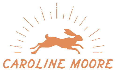 A logo featuring a leaping hare with sunburst lines behind it, and the name Caroline Moore below in stylized text.