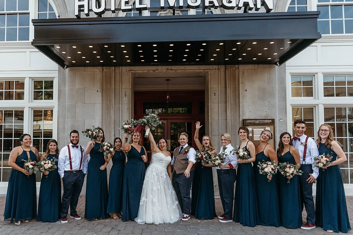 wedding party group photo taken under the hotel morgan sign