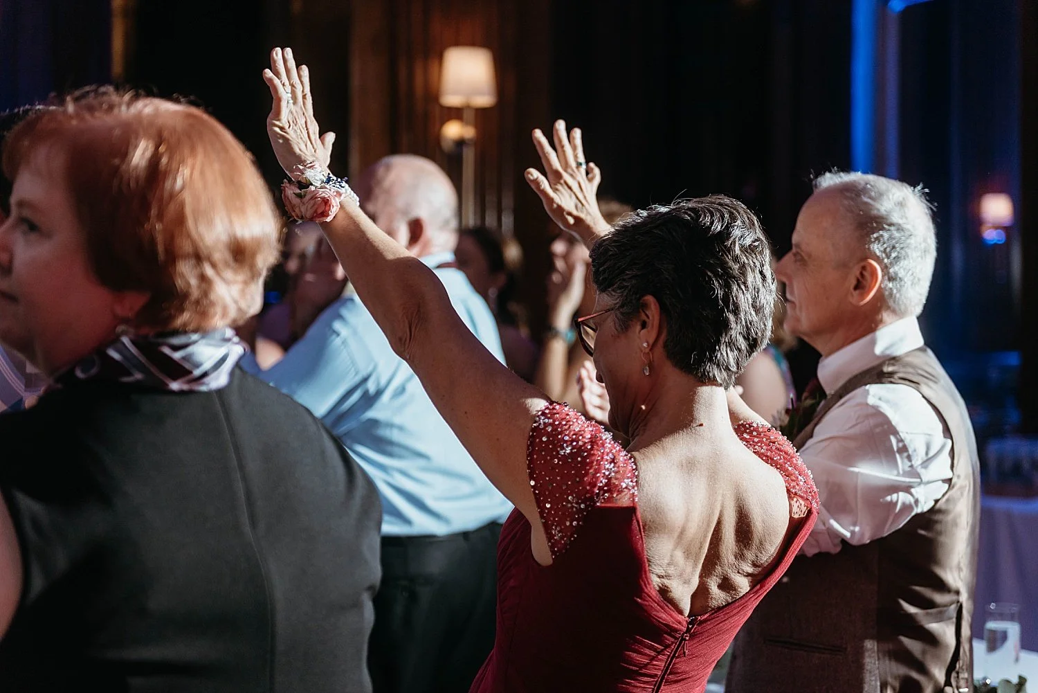 Groom's mom puts her hands in the air