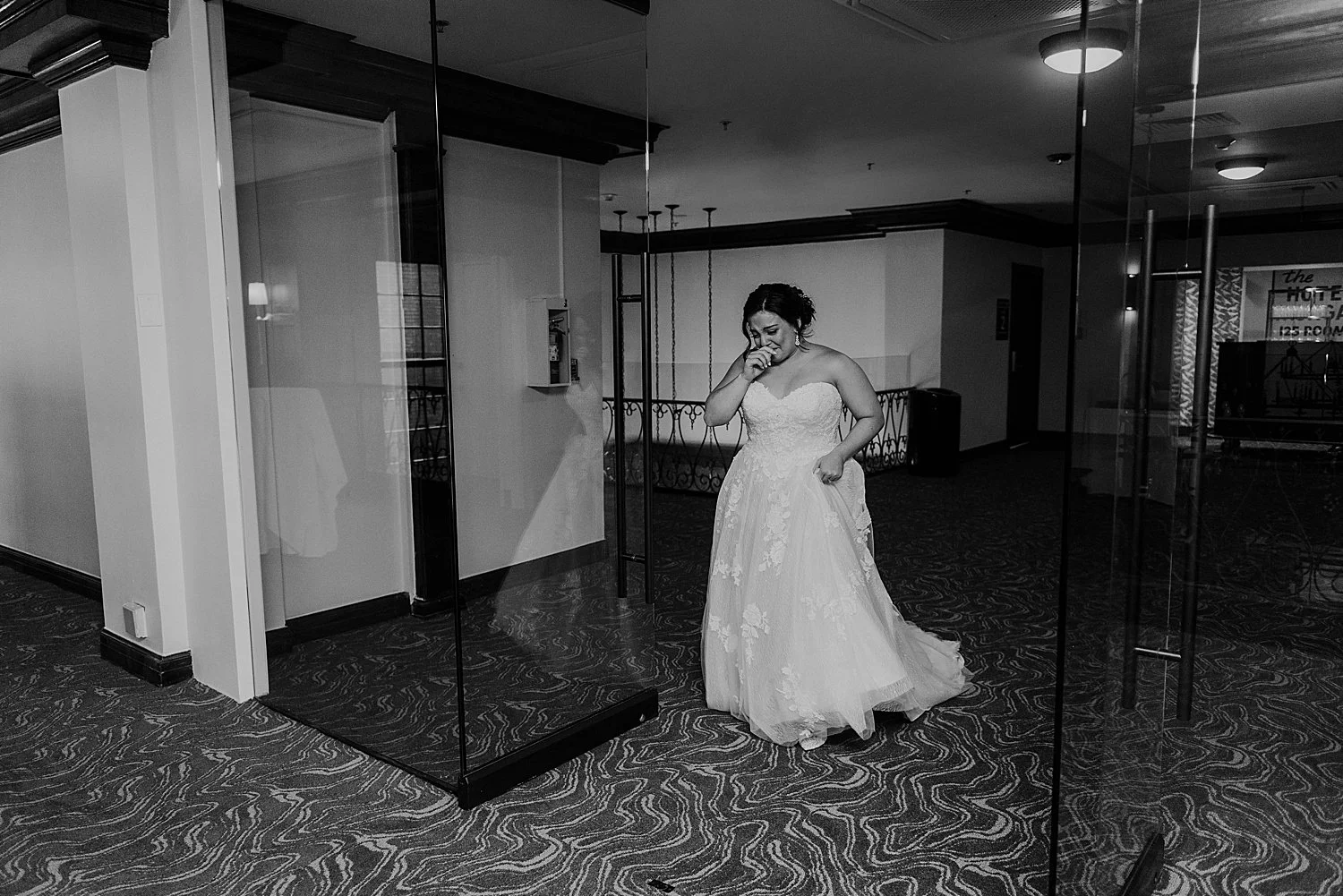 Bride crying as she walks up for her first look with her groom
