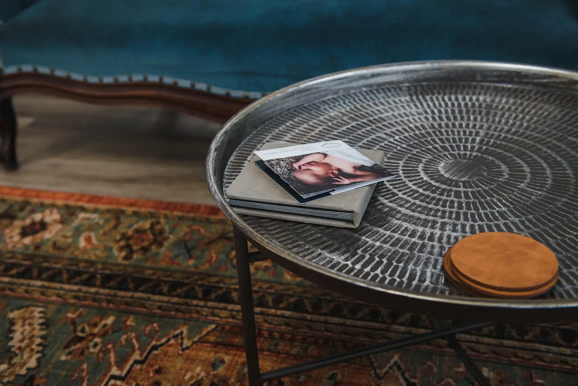 metal table on a printed rug