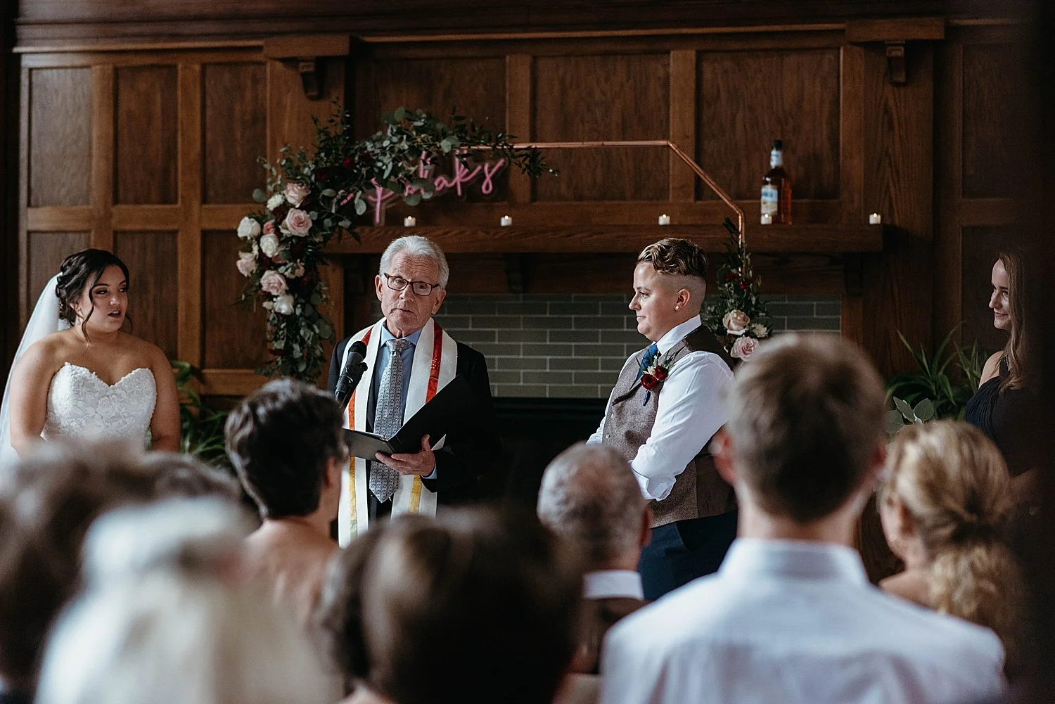 Officiant at Hotel Morgan wears a rainbow scarf for this LGBT wedding