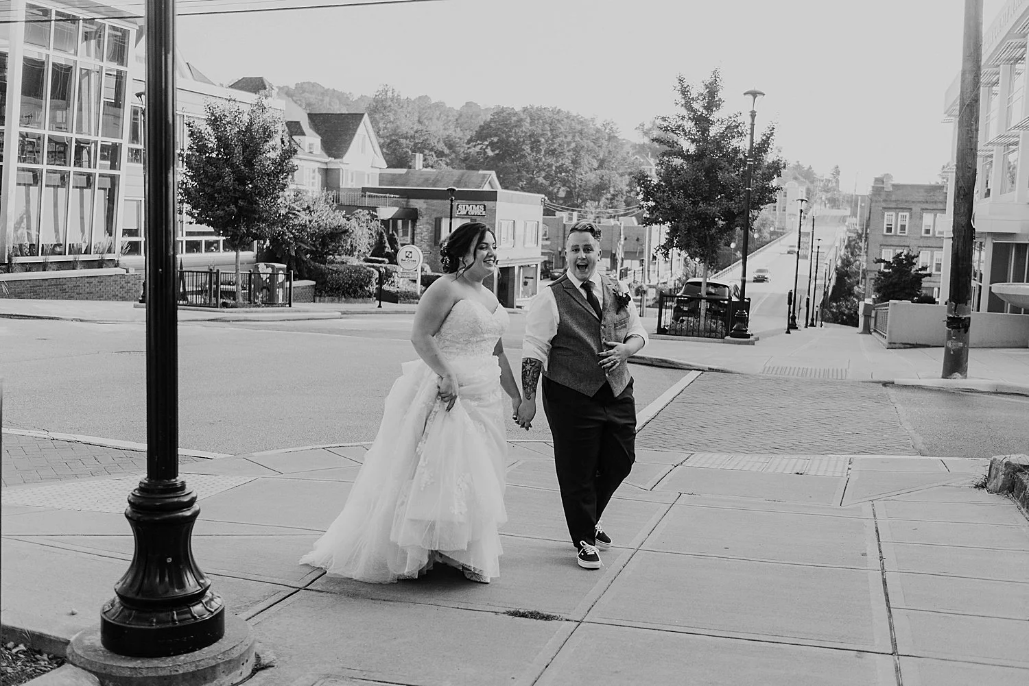 Bride and groom walking back to hotel morgan