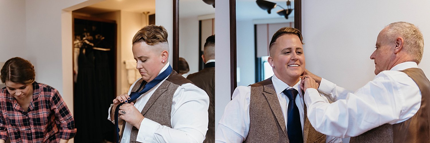 Groom's dad helps him to fix his tie