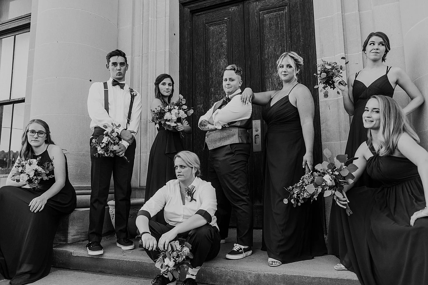 A wedding party looks sort of over it in this black and white photo