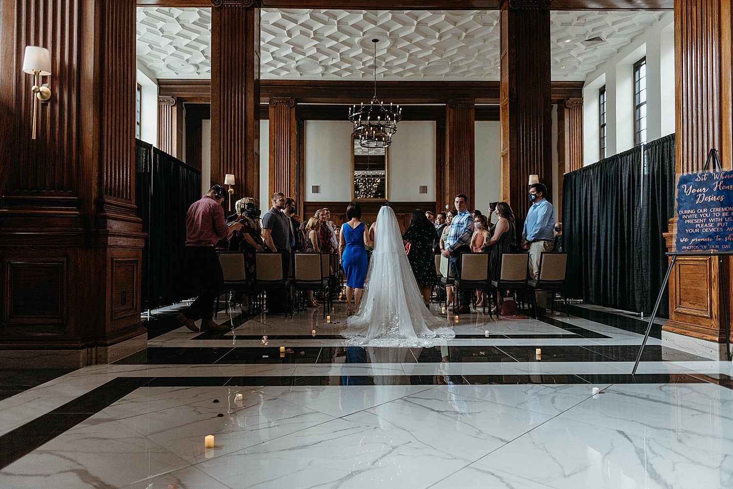 View from the back of the ceremony at hotel morgan, bride has a long veil