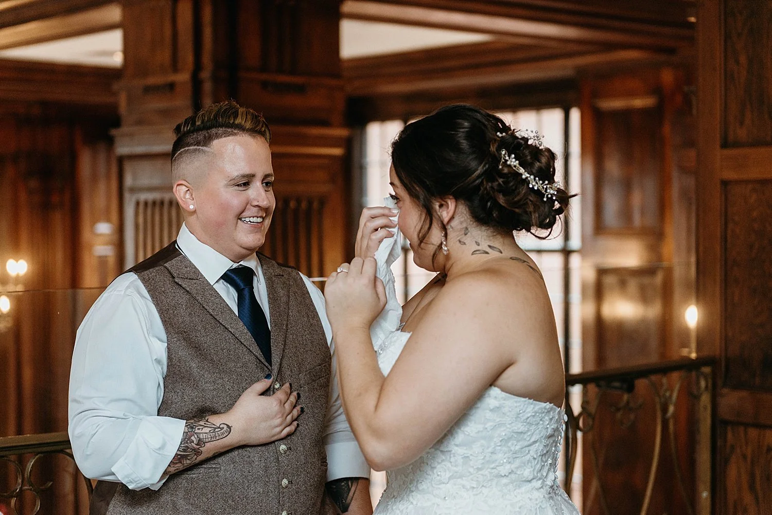 LGBT couple have their first look before their wedding, the bride has a tissue