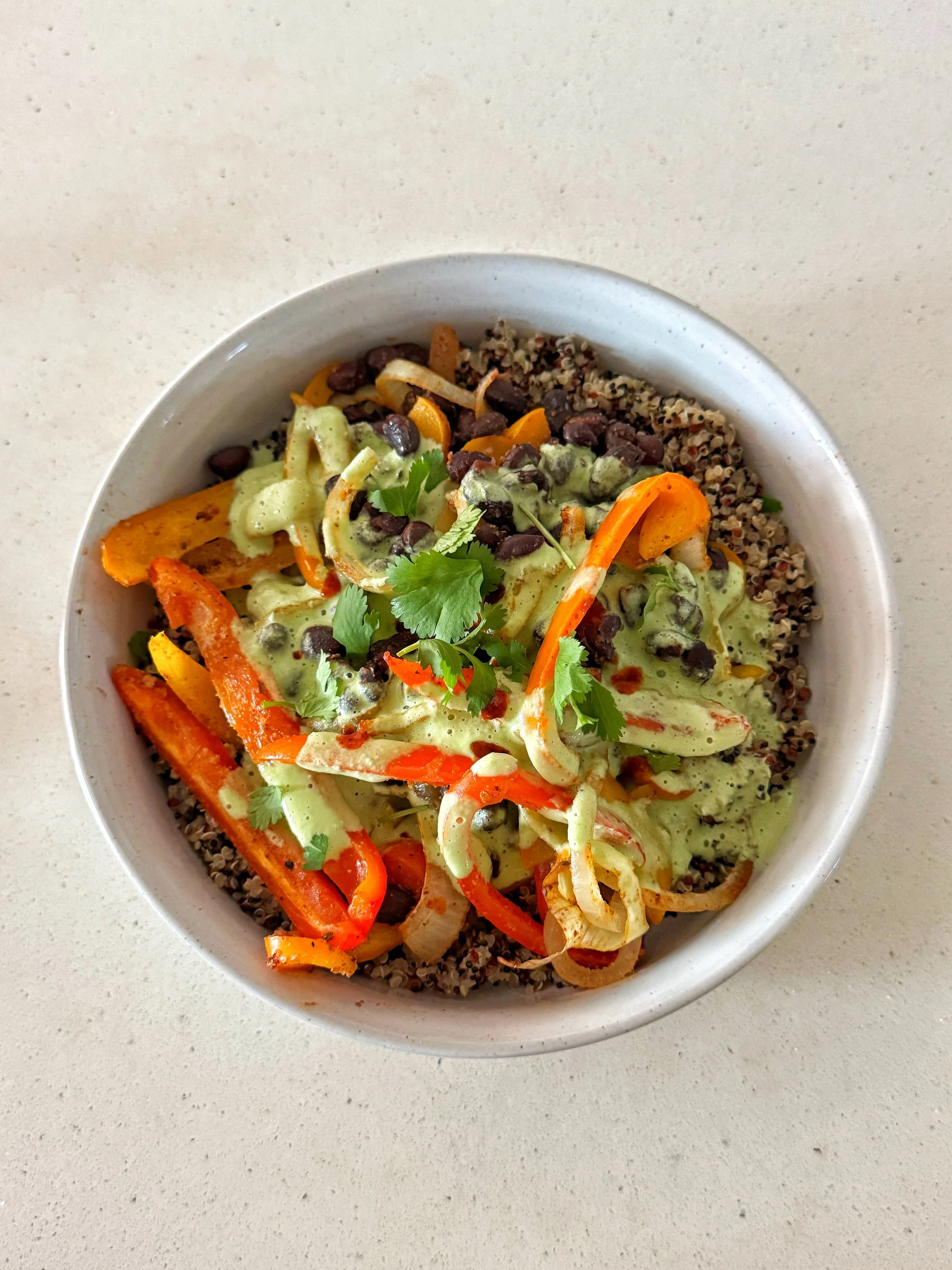 Baked Fajita Quinoa Bowl With A Cilantro Lime Crema