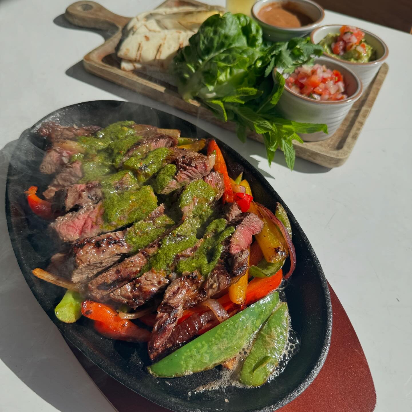 Fall in love with the flavors of our new menu launching today. 

SIZZLING PLATTERS with choice of scotch fillet, tandoori chicken, or mushroom &amp; tofu. 

All served with tomato salsa, refried beans, guacamole, lettuce and tortilla chips.

#maveric