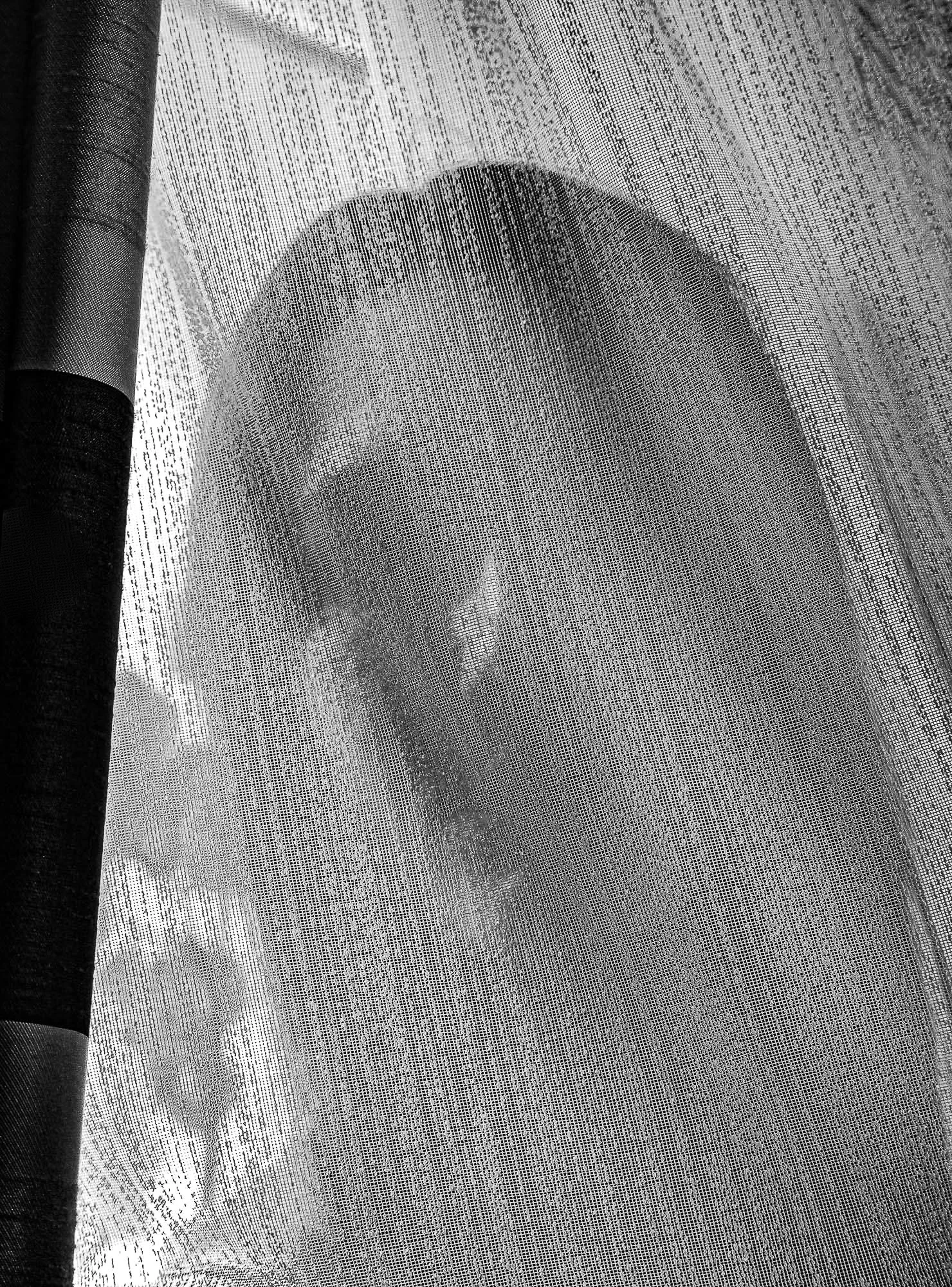 Lacra Grozavescu - The Place That Forgets You explores the domestic interior as a space where comfort and pressure quietly coexist. The project treats the house as a psychological organism — one that observes, records, and shapes identity. Familiar o