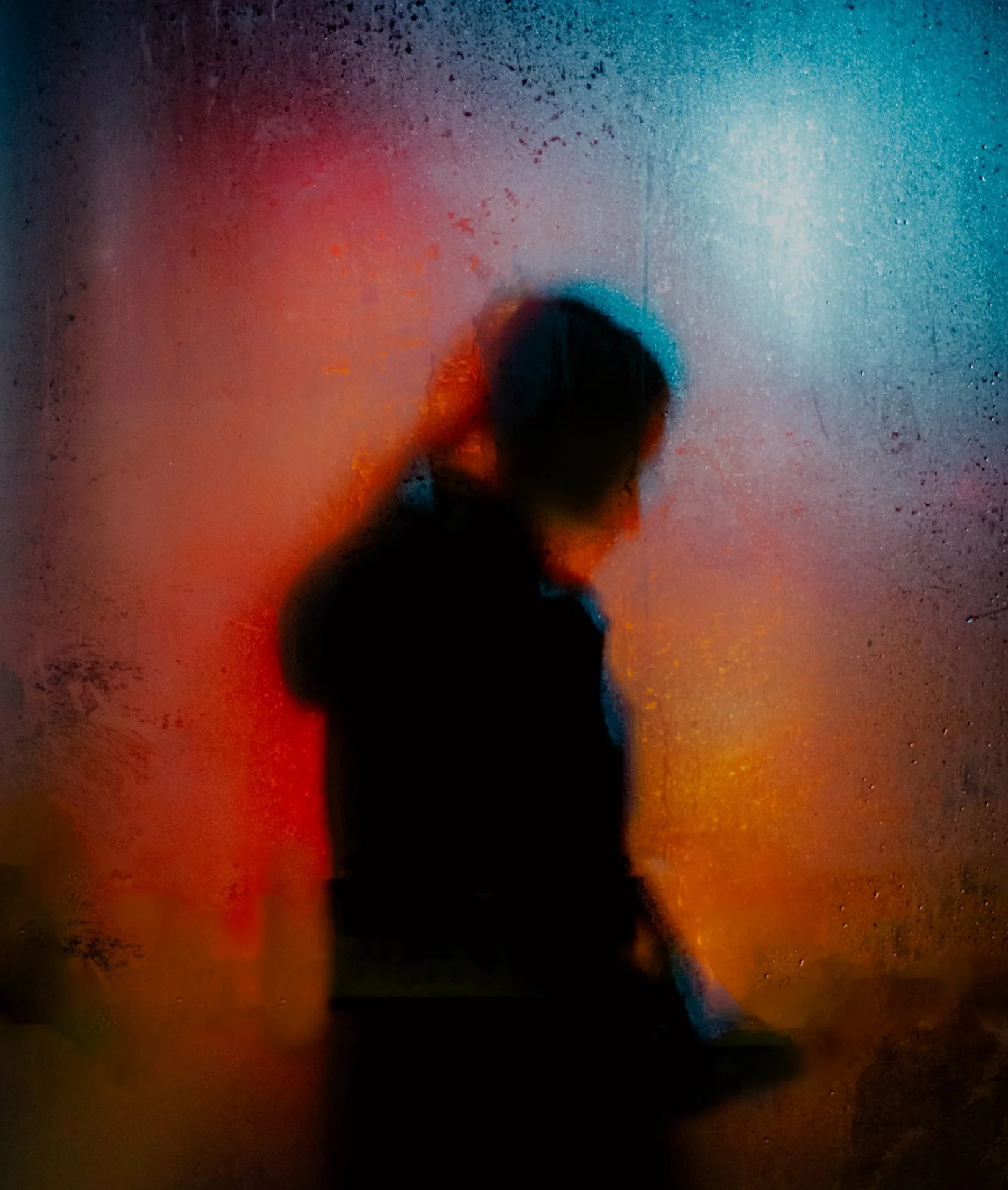 Nat Persoglio - Manchester: bus windows, shelters, rain, glass and night light. I’m interested in how mental strain sits inside our ordinary movement through life, in the way we get from place to place while part of us feels held somewhere else. The 