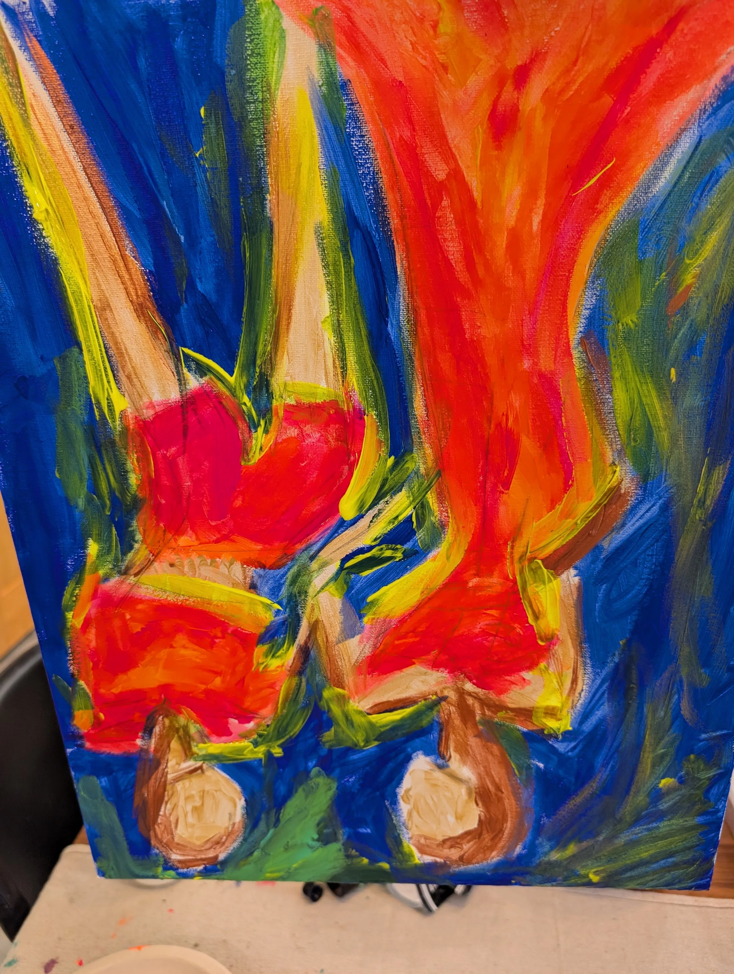 Abstract colorful painting with vibrant reds, oranges, blues, and greens.