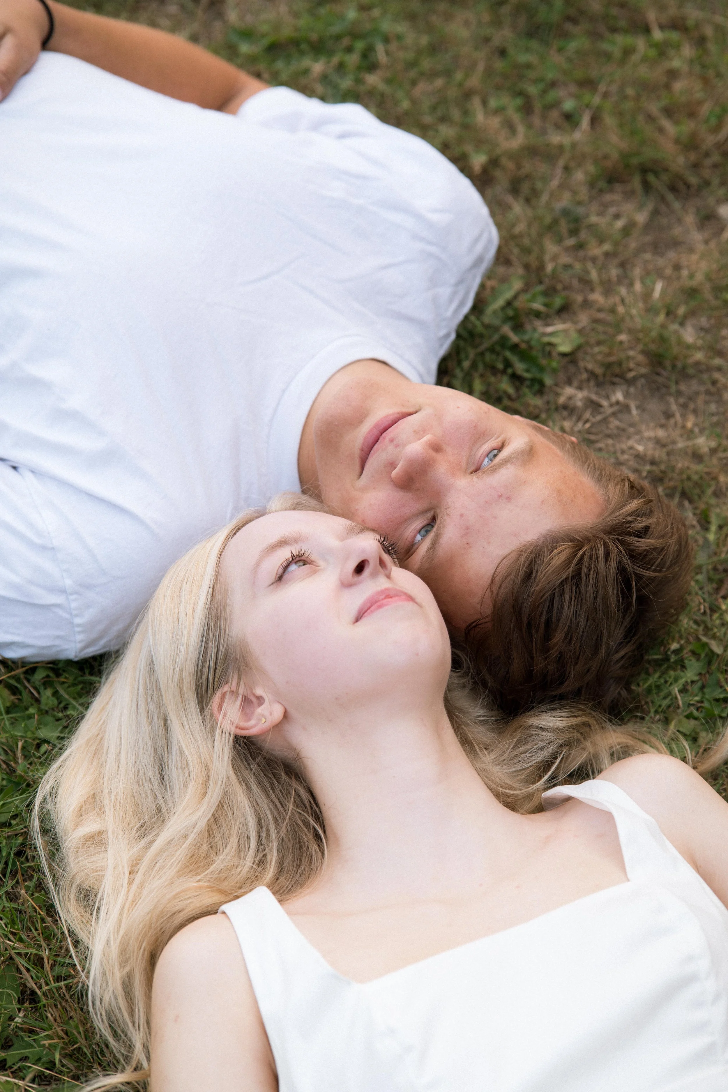 Kiarrah and Julian beneath a tree during their West Vancouver engagement photography session.