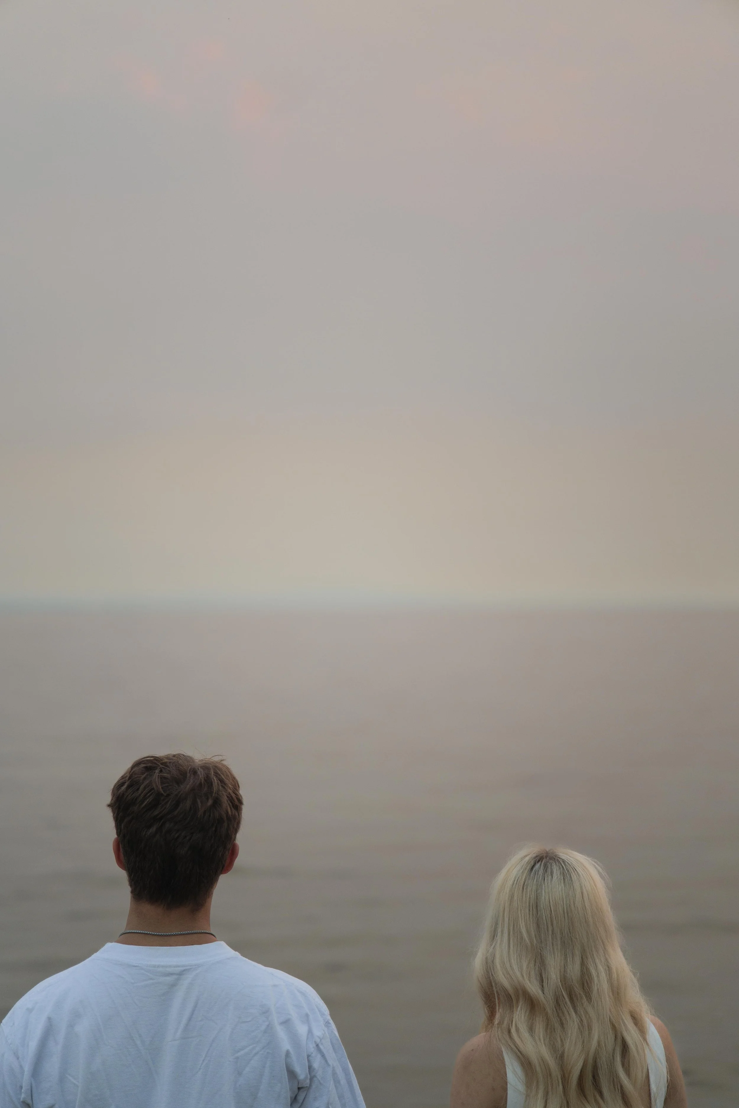 Kiarrah and Julian looking out into the horizon during their West Vancouver engagement photography session.