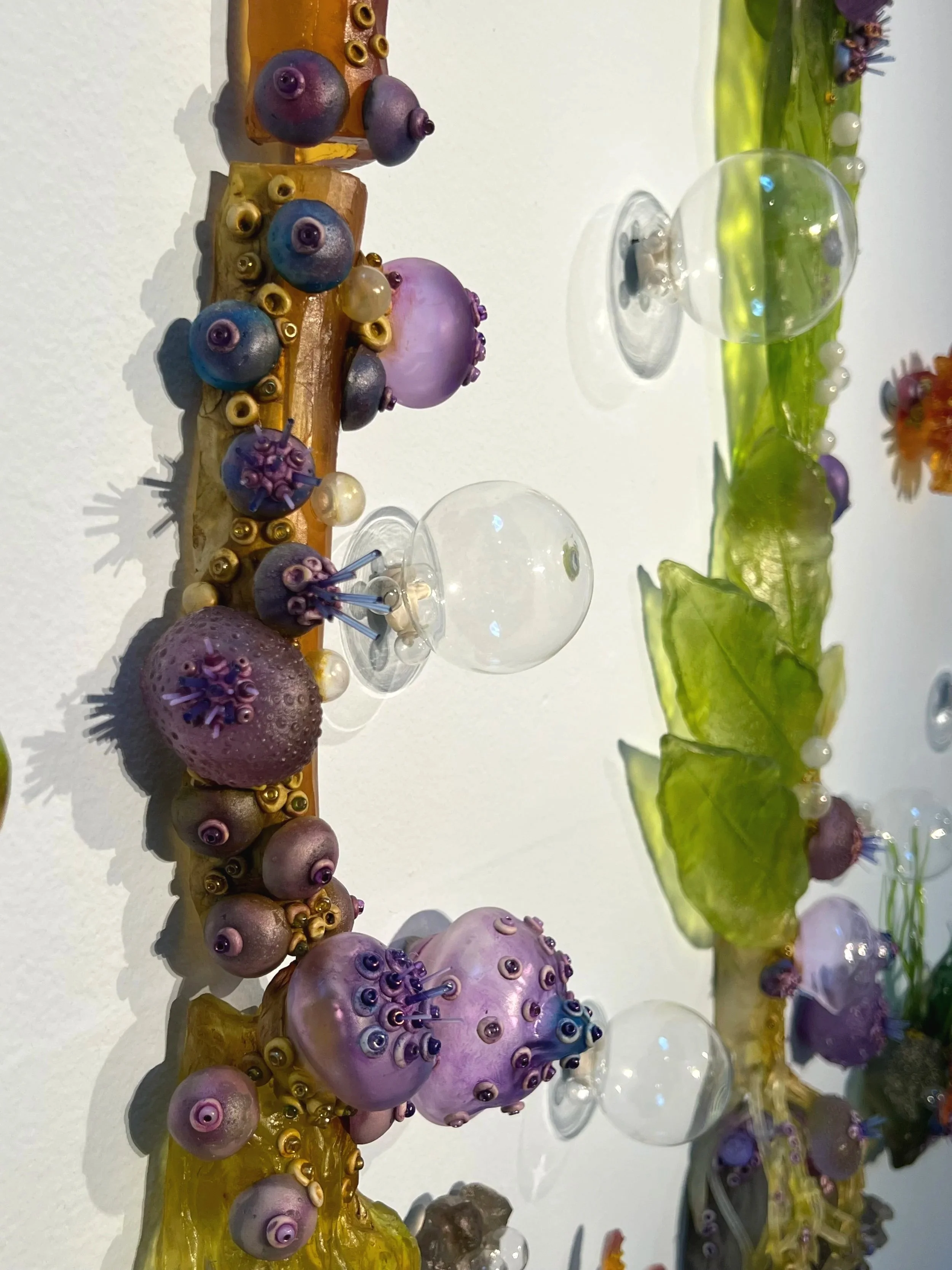 Detail of: Crista Van Slyck Matteson, Sunflower Sea Star, an Apex Predator, 2026, kiln cast, pate de verre, flame worked and blown glass, 7 x 8 ft, photo credit: Crista Van Slyck Matteson