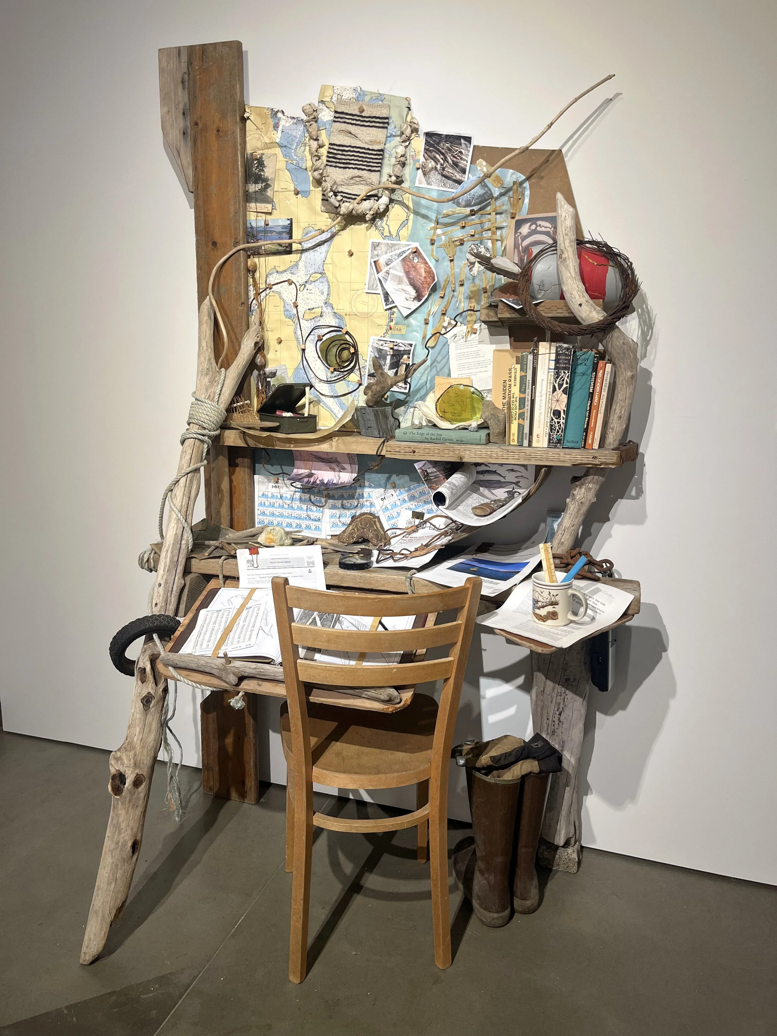 John Schmitz, Fathom (A Drift Log), 2026, Salvaged wood, beach wrack, various items, 81” x 49” x 28”