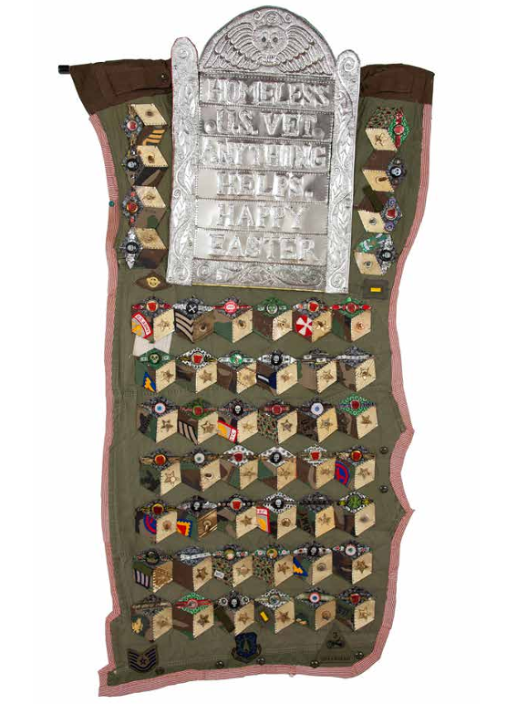 Happy Easter, 2017. Fabric, tin, oil paint, patches, bullet casings, and found objects, 60 × 33 in.  Courtesy of Greg Kucera Gallery, Seattle