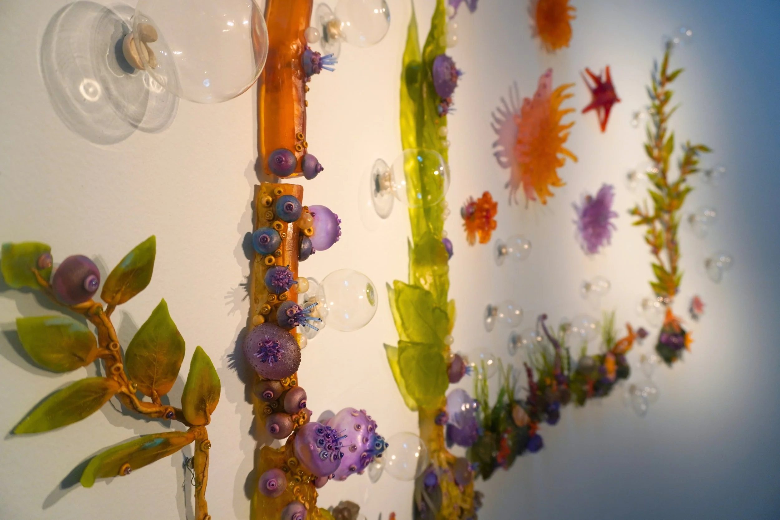Detail of: Crista Van Slyck Matteson, Sunflower Sea Star, an Apex Predator, 2026, kiln cast, pate de verre, flame worked and blown glass, 7 x 8 ft