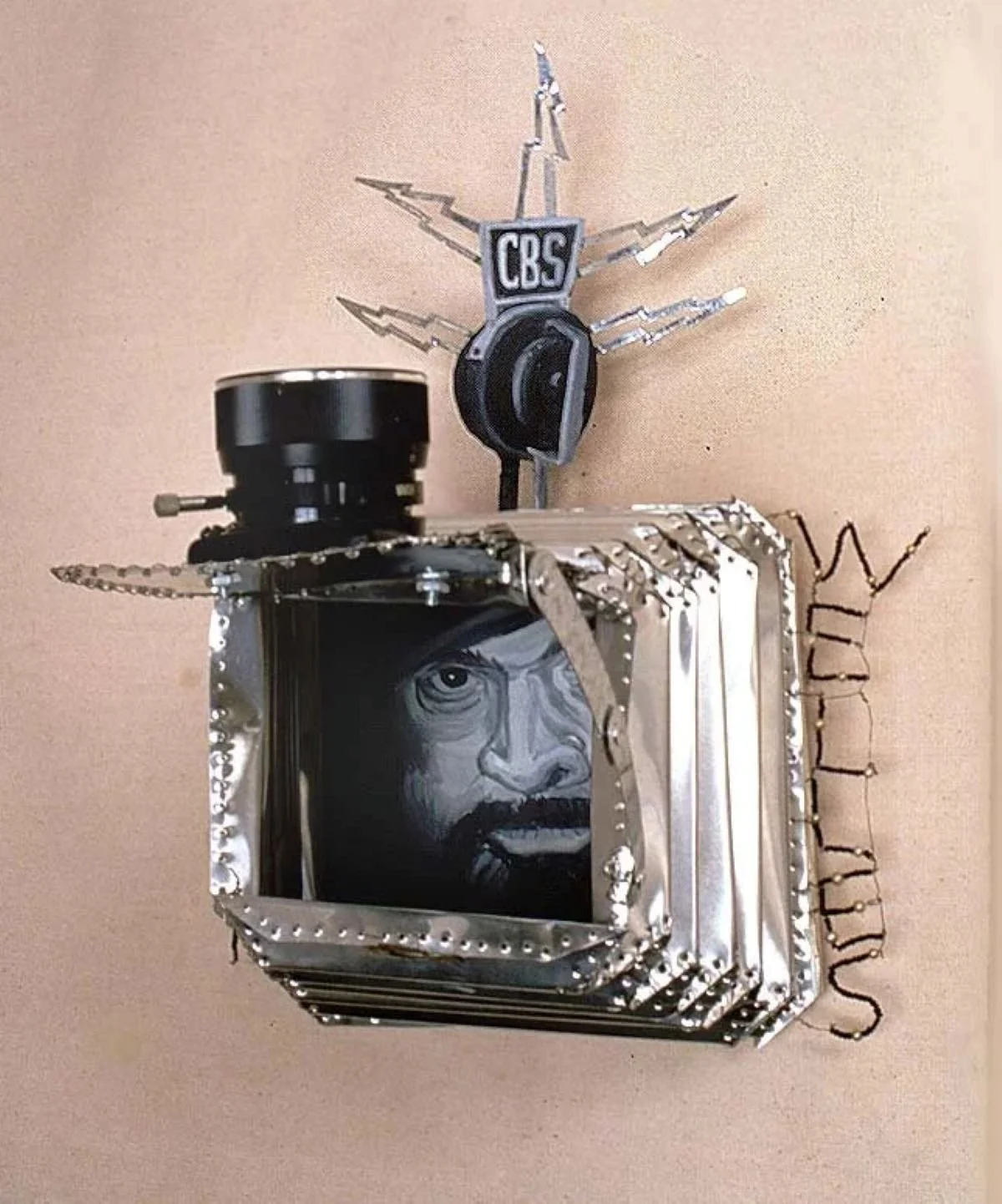 Ross Palmer Beecher, Orson Wells, 2000, Oil, aluminum, tin, wire, camera parts, beads, found objects 15.5 x 10.5 x 12, Greg Kucera Gallery