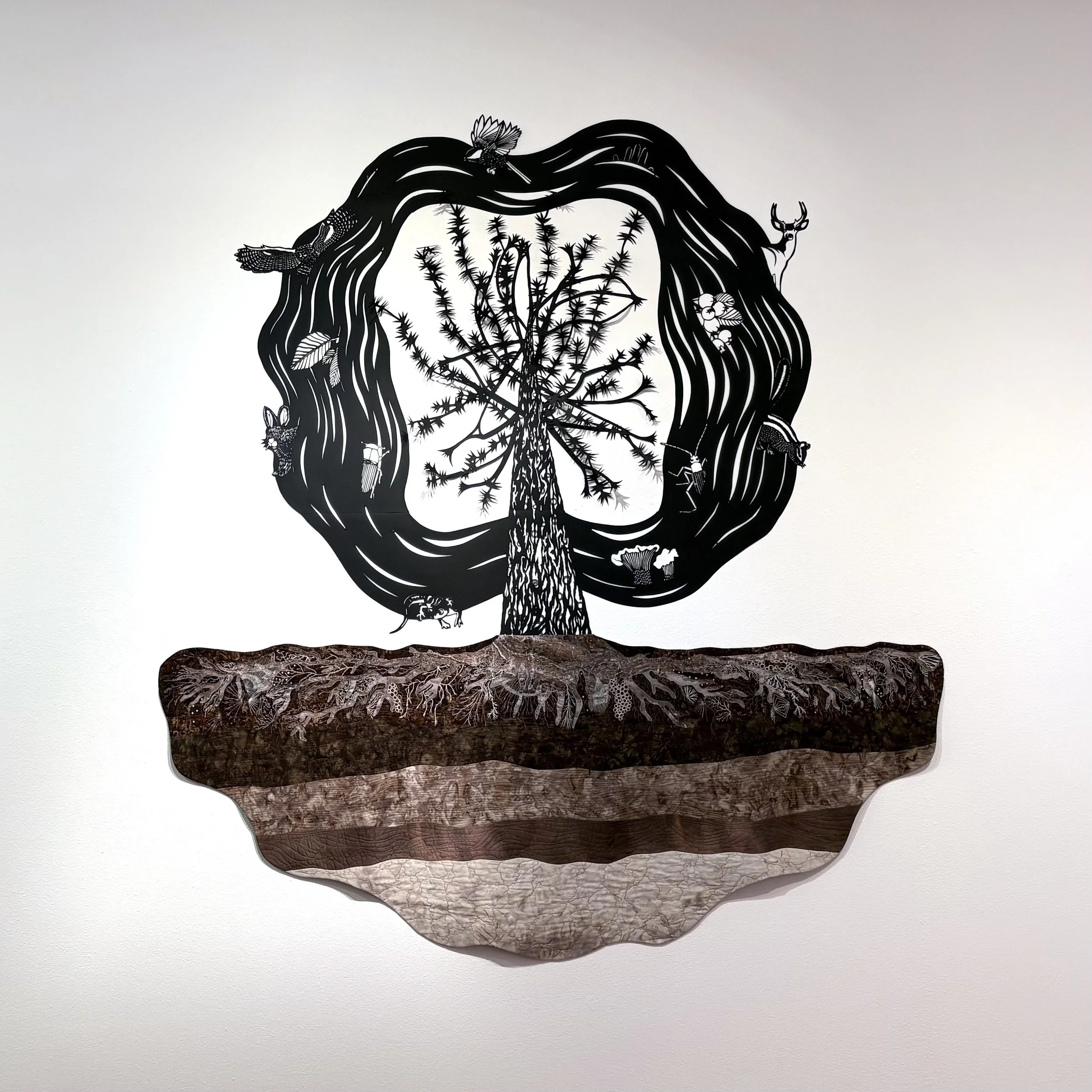 Ann Chadwick Reid, Refugium, 2026, Hand-cut paper and textiles, 45" x 80", image courtesy of the artist