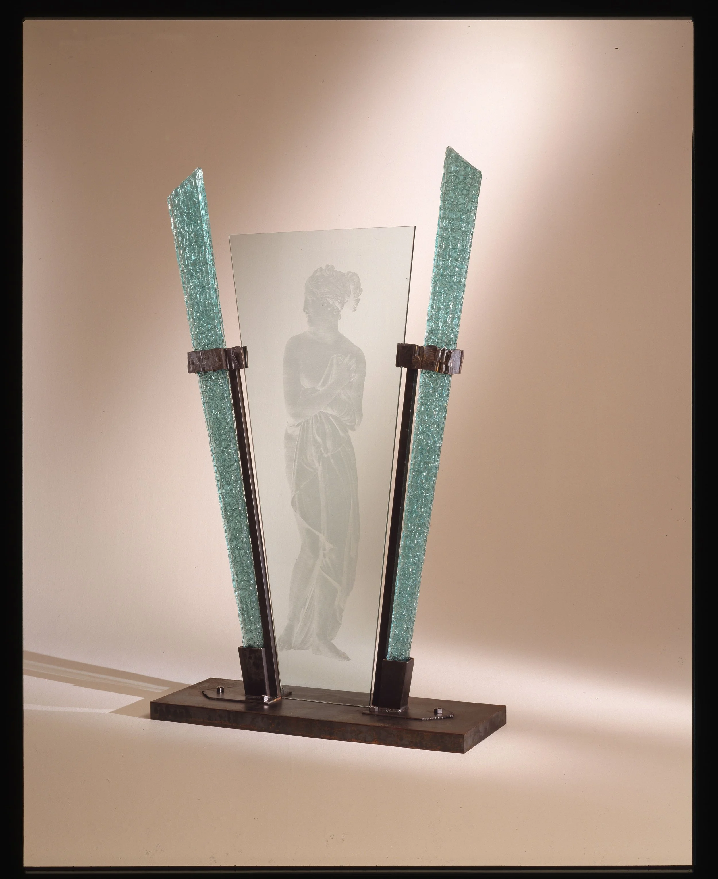 Nancy Mee, Venus Vector, 1992, Fused and slumped glass, photo-sandblasted glass, forged and fabricated steel, courtesy of Nan Romney collection - Yakima, WA