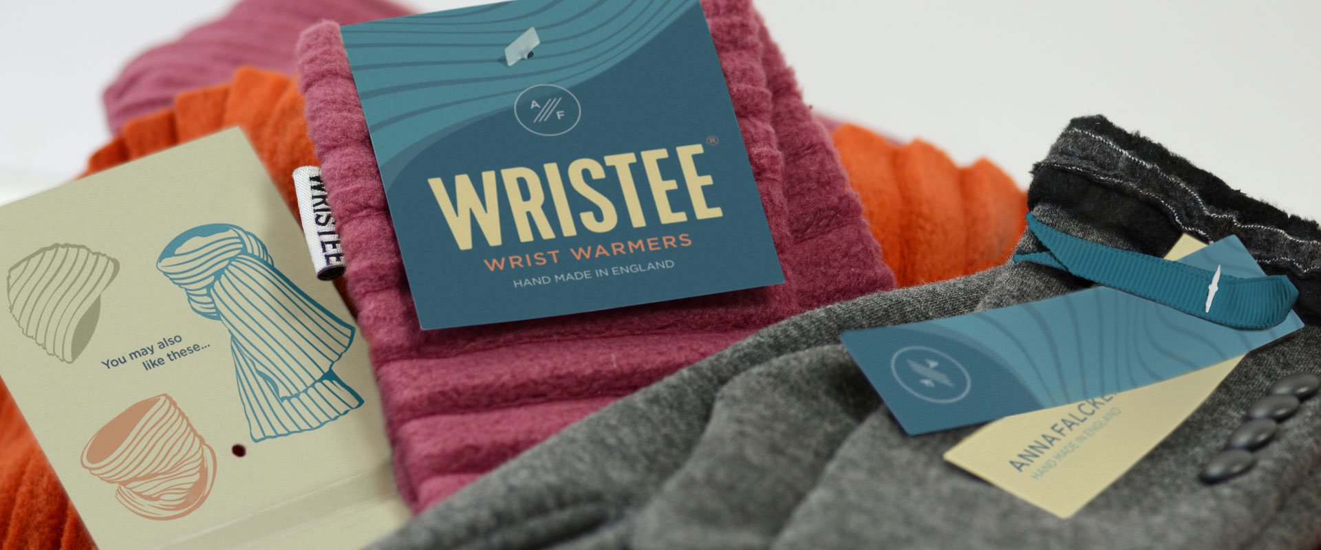 A photo of the new label design on some products - gloves, wristees and a scarf