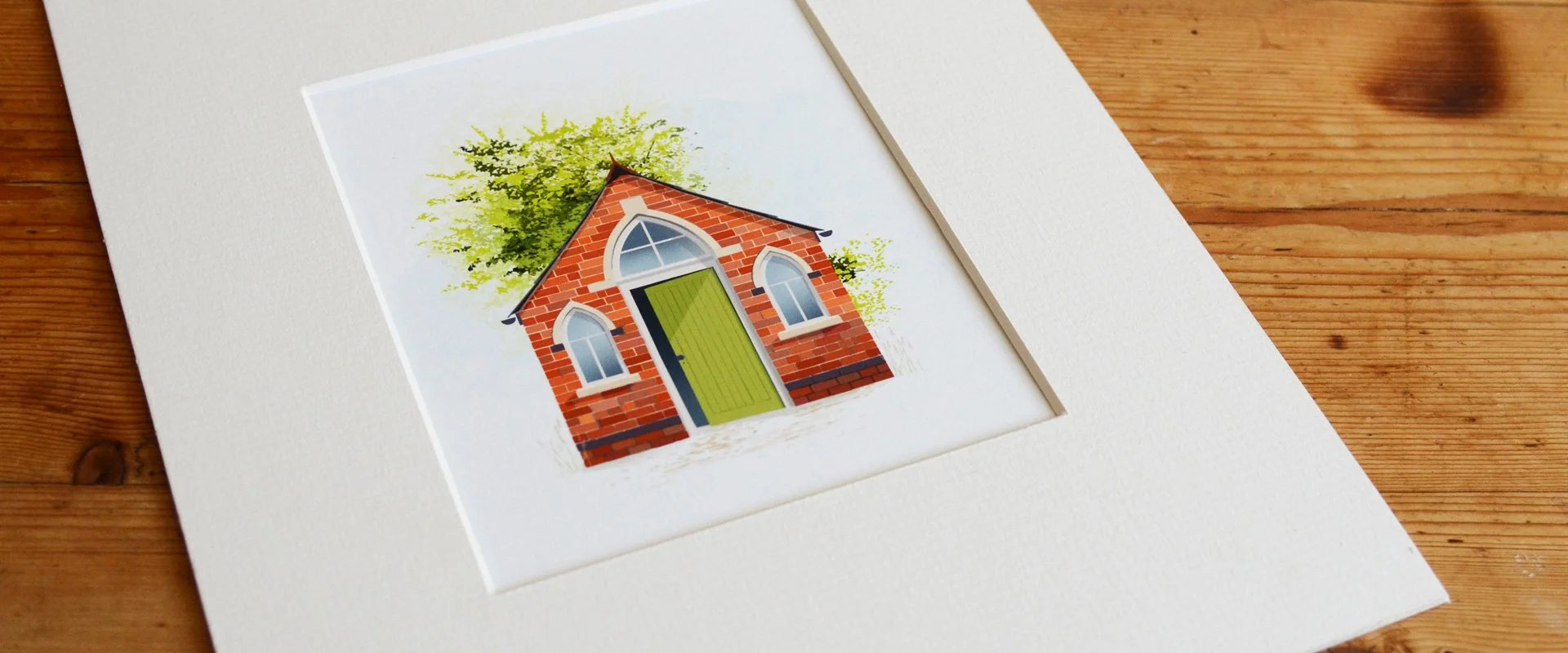Red brick miniature chapel after a paper renovation. Arched windows and a green door