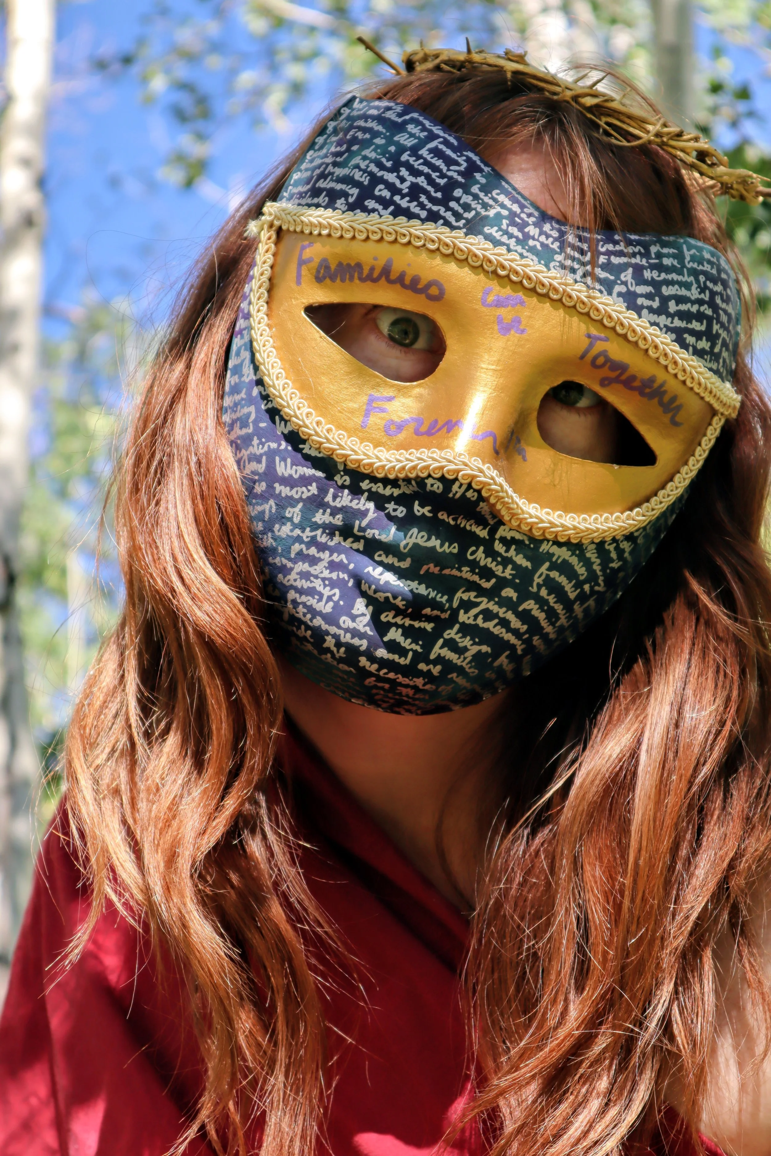 River Mountain, Families Can Be Together Forever™, Paper mask, metallic wax, ink, 2026
