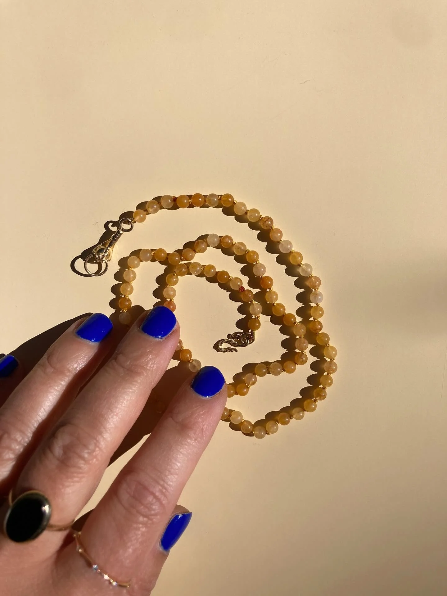 Golden light, caught and strung like morning sunbeams. 
Each bead of lemon quartz glows with warmth — hand-knotted on silk, finished with our signature 14k gold clasp, and made to radiate joy just like little lemon drops.
Said to clear the min