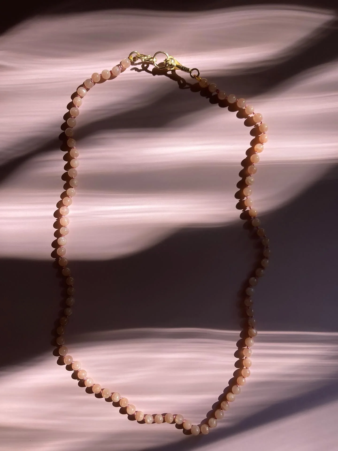 A Strand of Blush and Light.
Hand-knotted in my atelier on soft pink silk, each smooth bead of rose quartz glows like a drop of dawn light caught in stone. Their tender hue, long cherished by Victorian romantics, speaks of compassion, beauty, and th