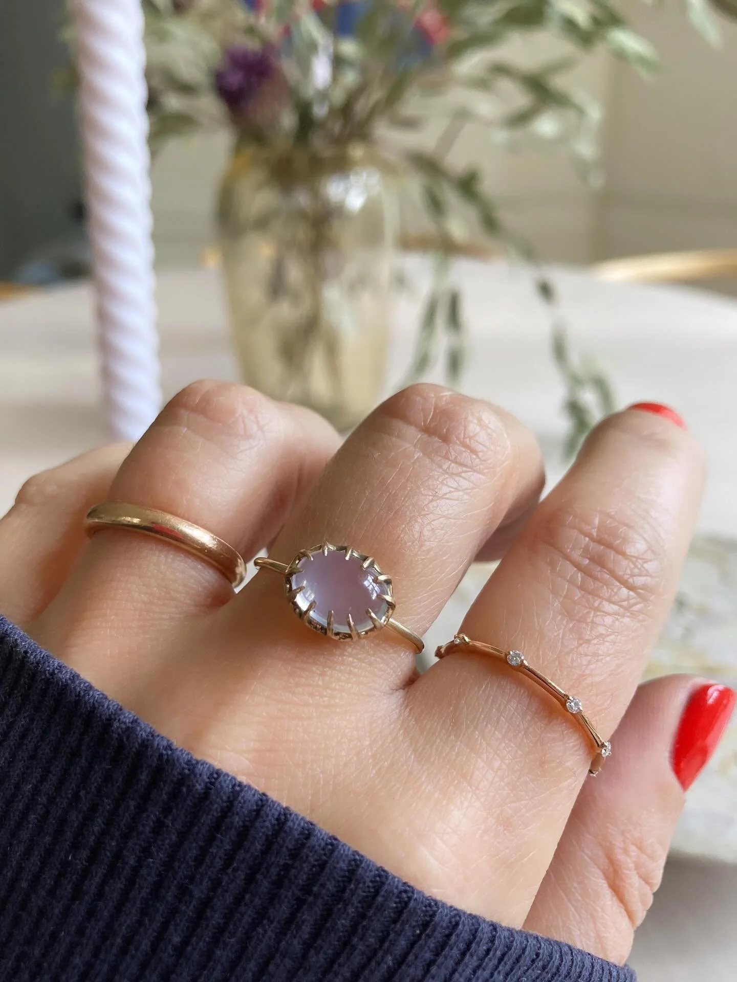 Some jewels arrive with a whisper, others with a glow.
This moonstone ring, once a slender Victorian stick pin, now rises on the hand like a small enchantment reborn. Its soft lavender-blue sheen feels almost otherworldly, a captured mist that shifts
