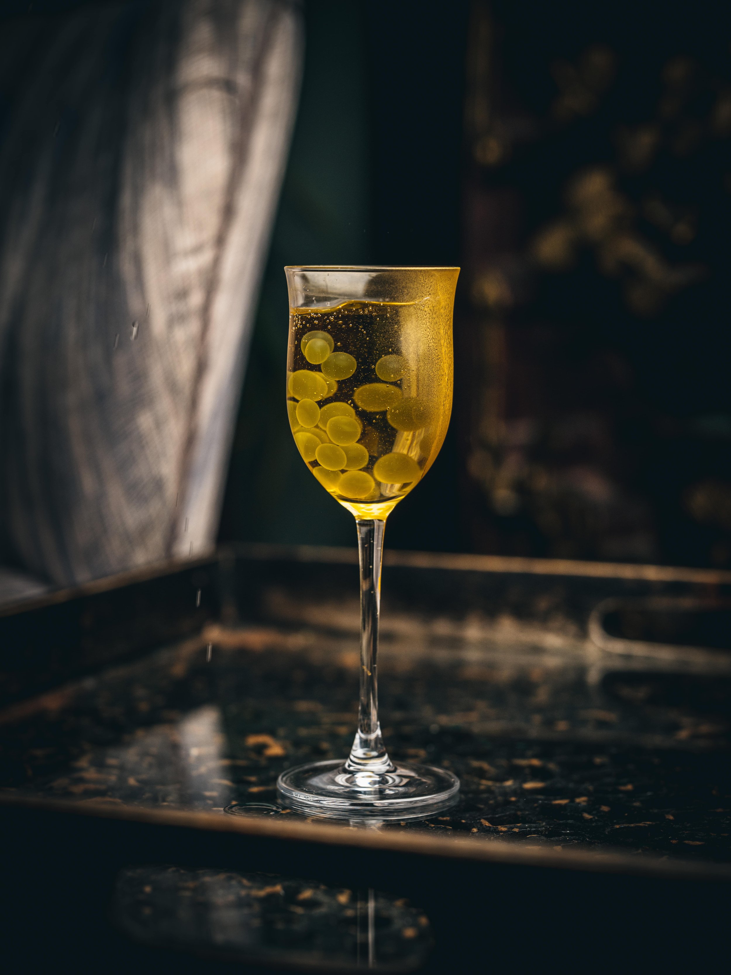 SPARKLING PEARLS - Hatozaki Blended whisky, Akashi-Tai Umeshu Liqueur, Akashi-Tai Junmai Ginjo Sparkling Sake, Supasawa, Sugar syrup, Yuzu Pearls.