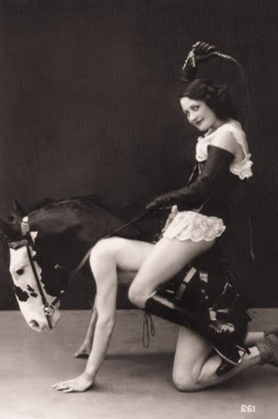 542-12-two models in pony play attire-Biederer Brothers.jpg