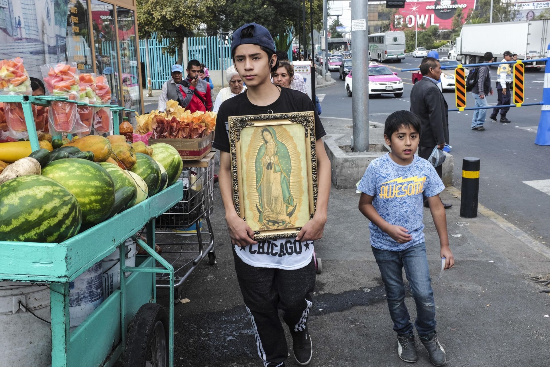 12/10/2016 - Mexico City, CDMX, Mexico. Two young pilgrims go towards the Basilica in Mexico City. The pilgrims arrived from any part of Mexico to offer proof of their devotion to Nuestra Señora.
