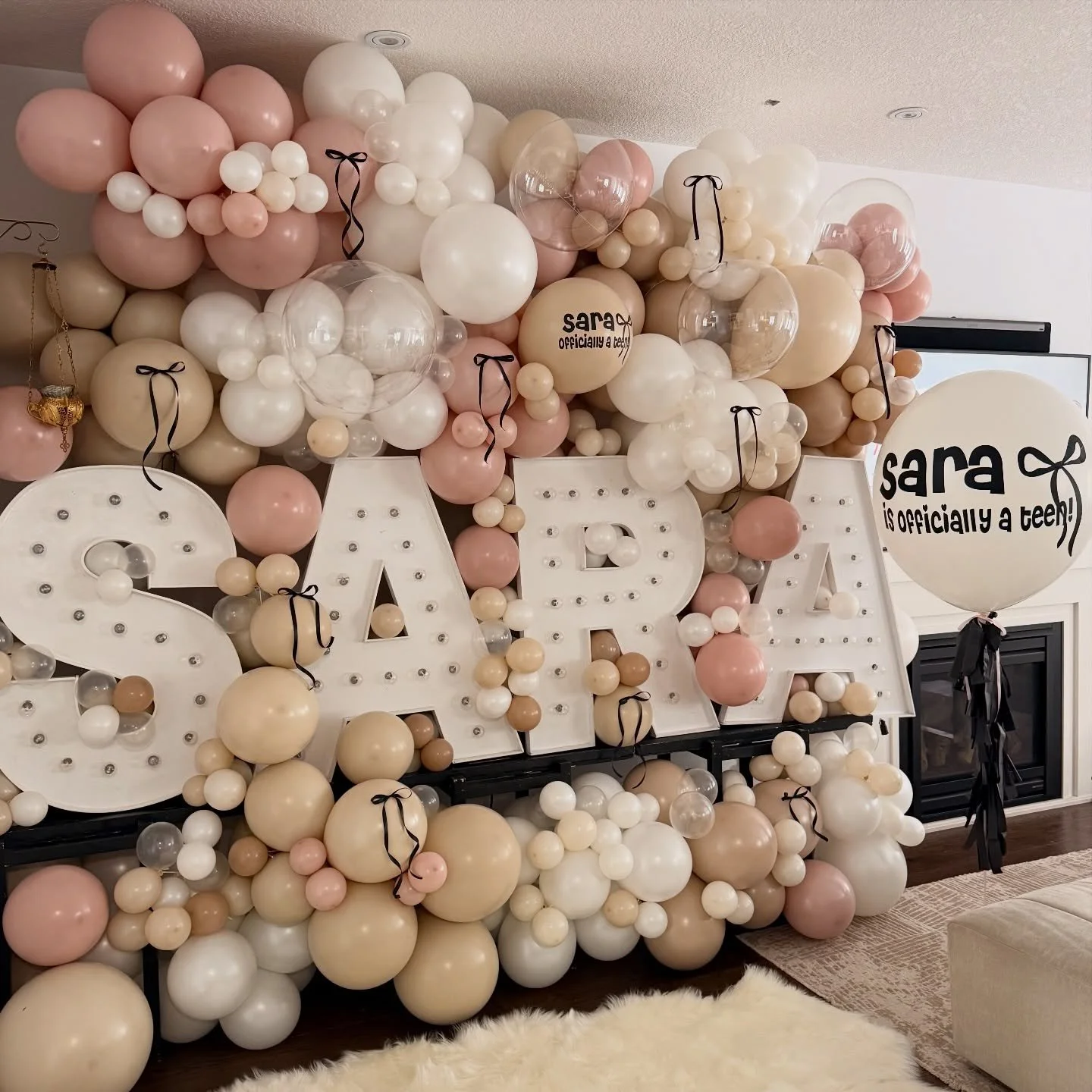 S A R A ✨

Her name spelled in marquee letters, surrounded by a full balloon wall &mdash; a statement moment for a milestone birthday.

Clean, elevated, and designed to make the space feel extra special from the moment you walk in.

Because some cele