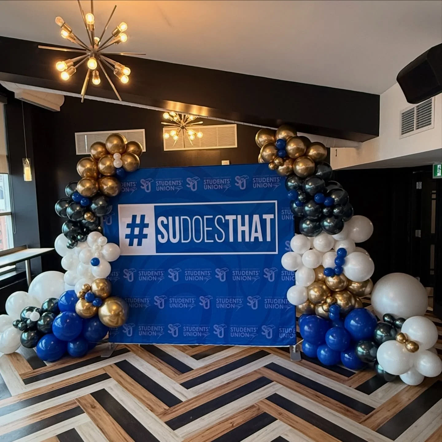 Bold, branded, and made to be seen 💙✨

I had the pleasure of creating this custom installation for the Wilfrid Laurier University Students&rsquo; Union &mdash; a statement backdrop designed to elevate the space and bring their branding to life in a 