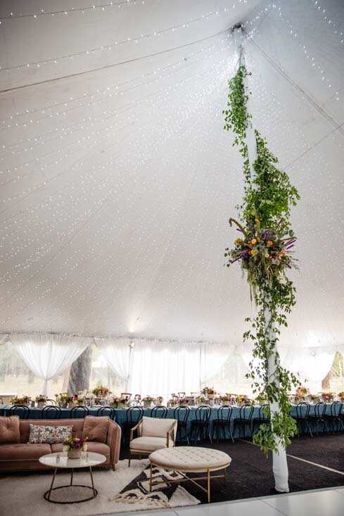 floral wrapped tent poles.jpg