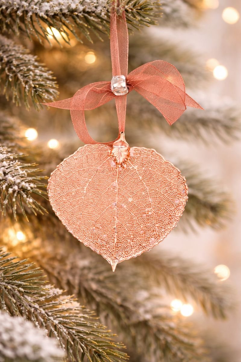 rose gold ornament hanging on a branch.jpeg
