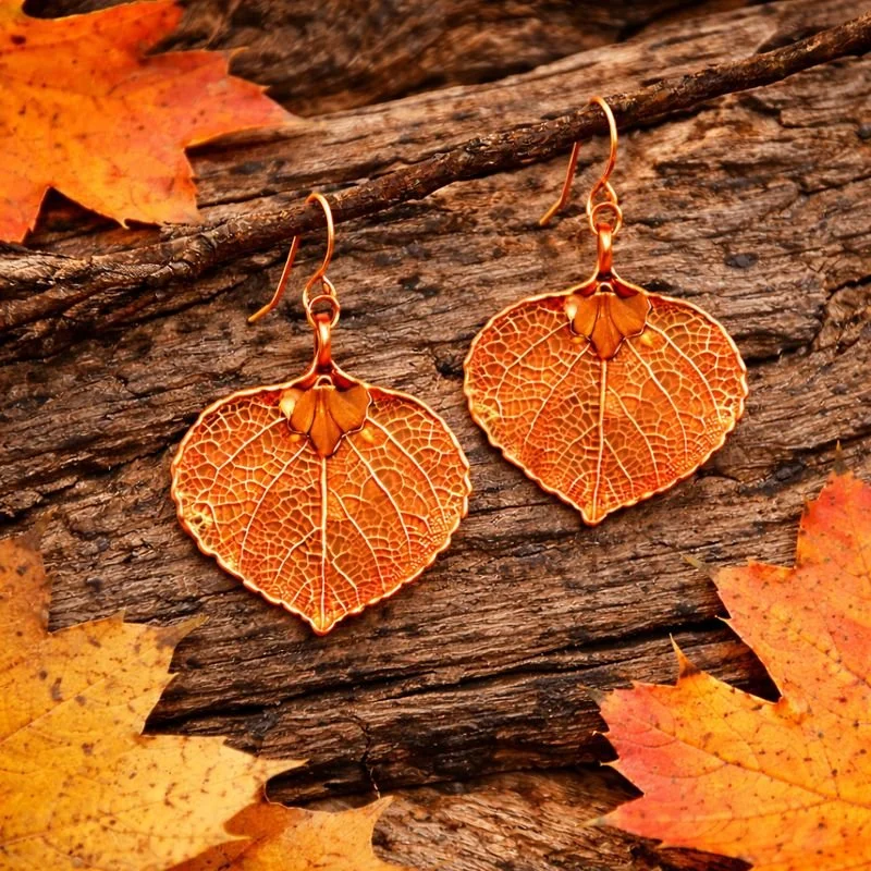 4 copper earrings on wood.jpeg