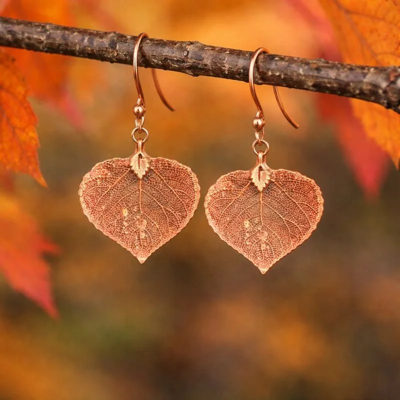 4 copper earrings on branch.jpeg