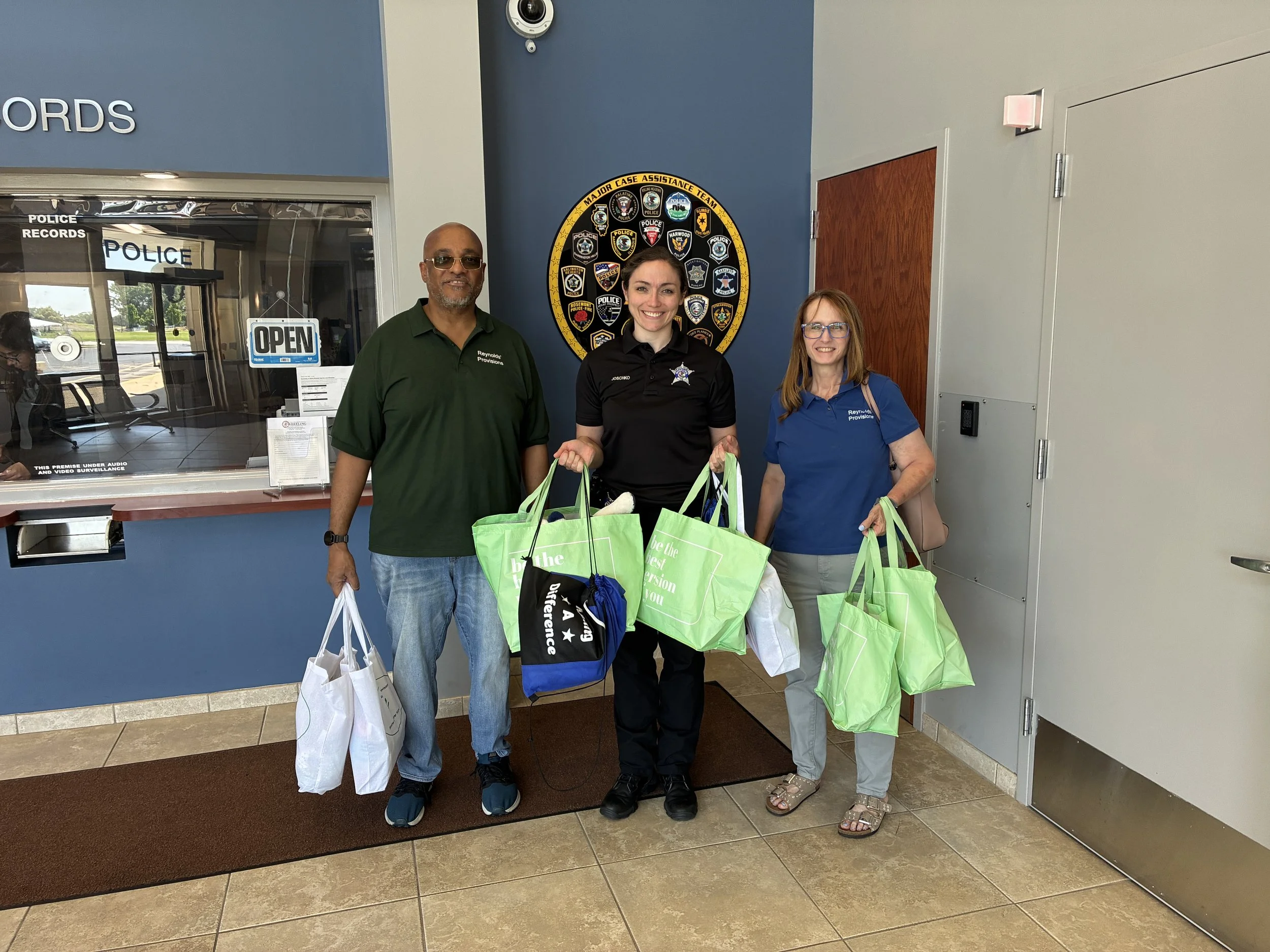 2026 - WHEELING POLICE DEPARTMENT-
Reynolds' Provisions NFP Inc. was honored to provide **10 Bears, Blessings & Books Care Packages** to assist children who experience traumatic situations while receiving support from local law enforcement.

When pol